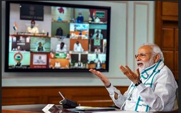 कोरोना कर्फ्यू और टीका उत्सव